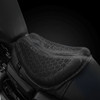 Black honeycomb motorcycle seat cushion fitted on a motorcycle seat, side view