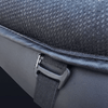 Close-up of an adjustable strap securing the cushion to a motorcycle seat
